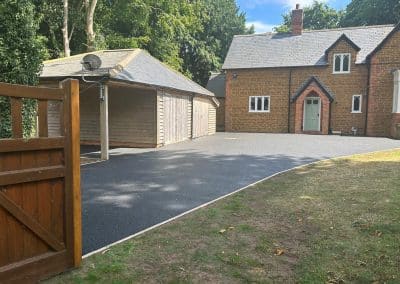 A finished black resin bound driveway at a period property in the Bedfordshire countryside