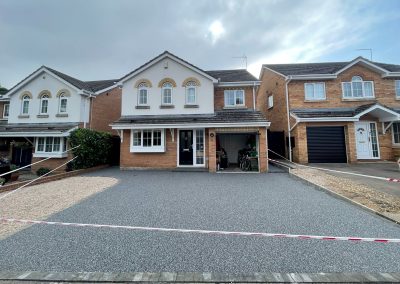 Residential resin bound driveway with two houses