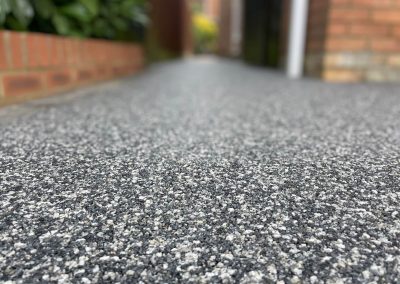 Close-up of dark grey resin bound surface