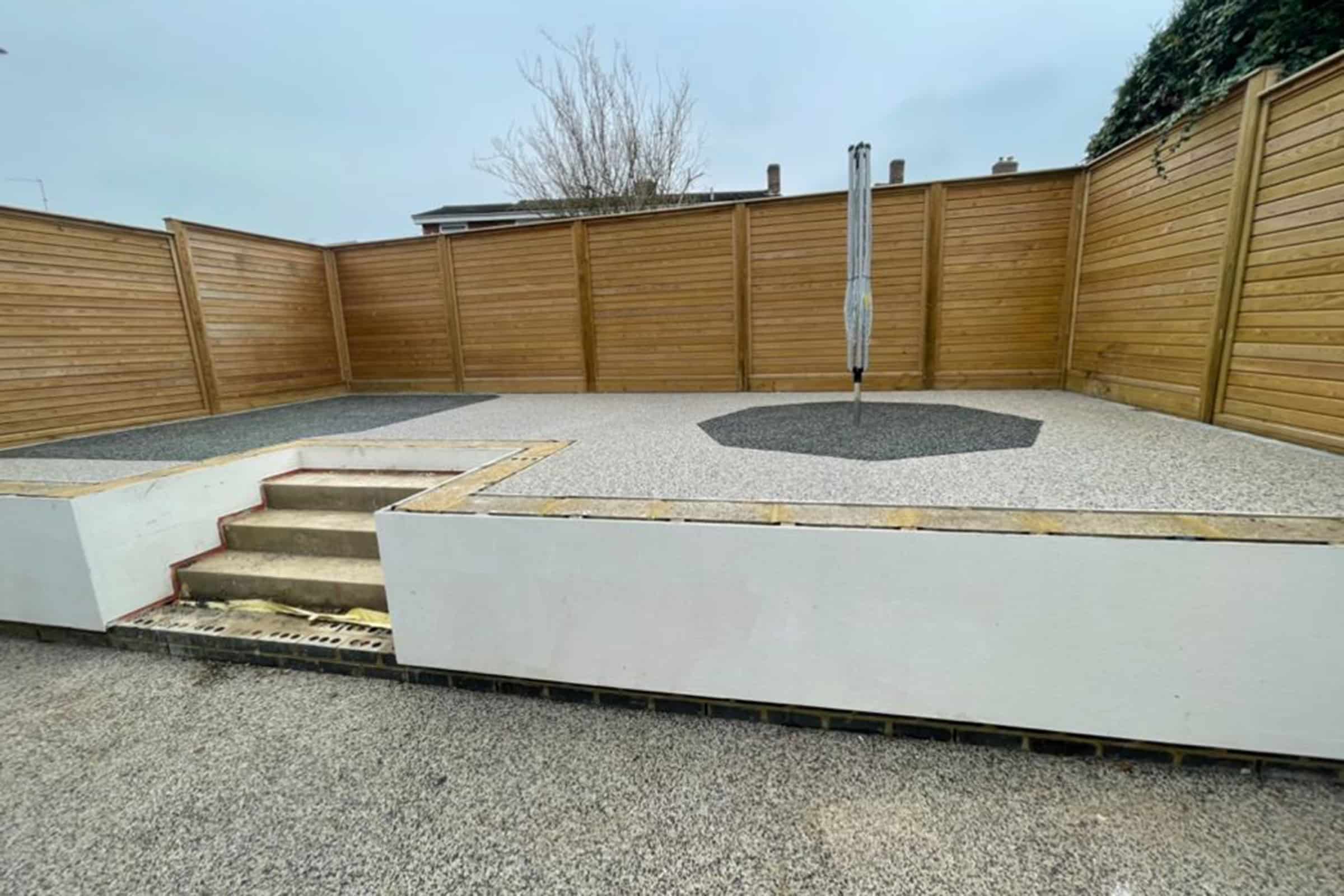 Resin bound outdoor space with wooden fence